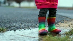 stock-footage-kid-jumping-in-puddle-slow-motion-rainbow-rubber-boots-300x168