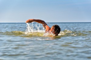 Young male swimming in the sea/ocean