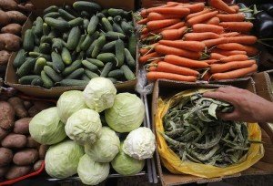 A vendor sells vegetables at the city market in St.Petersburg